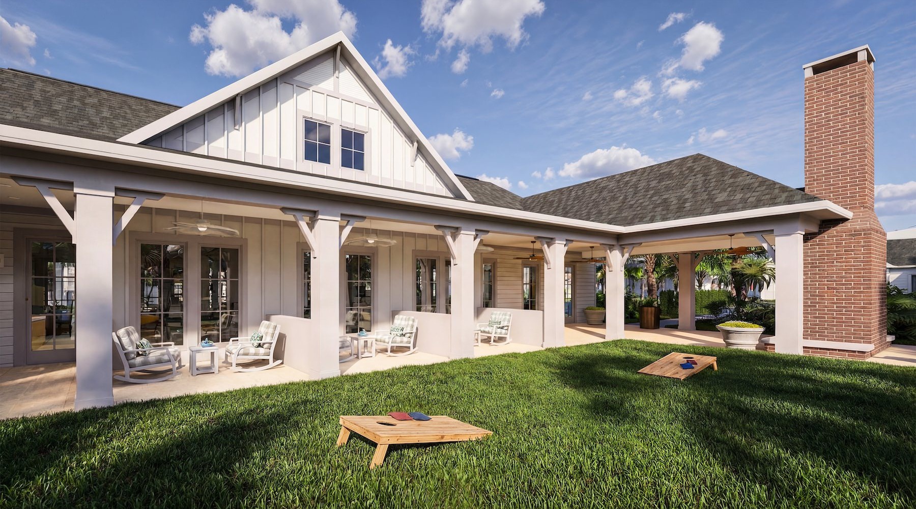 a white building with chairs and cornhole