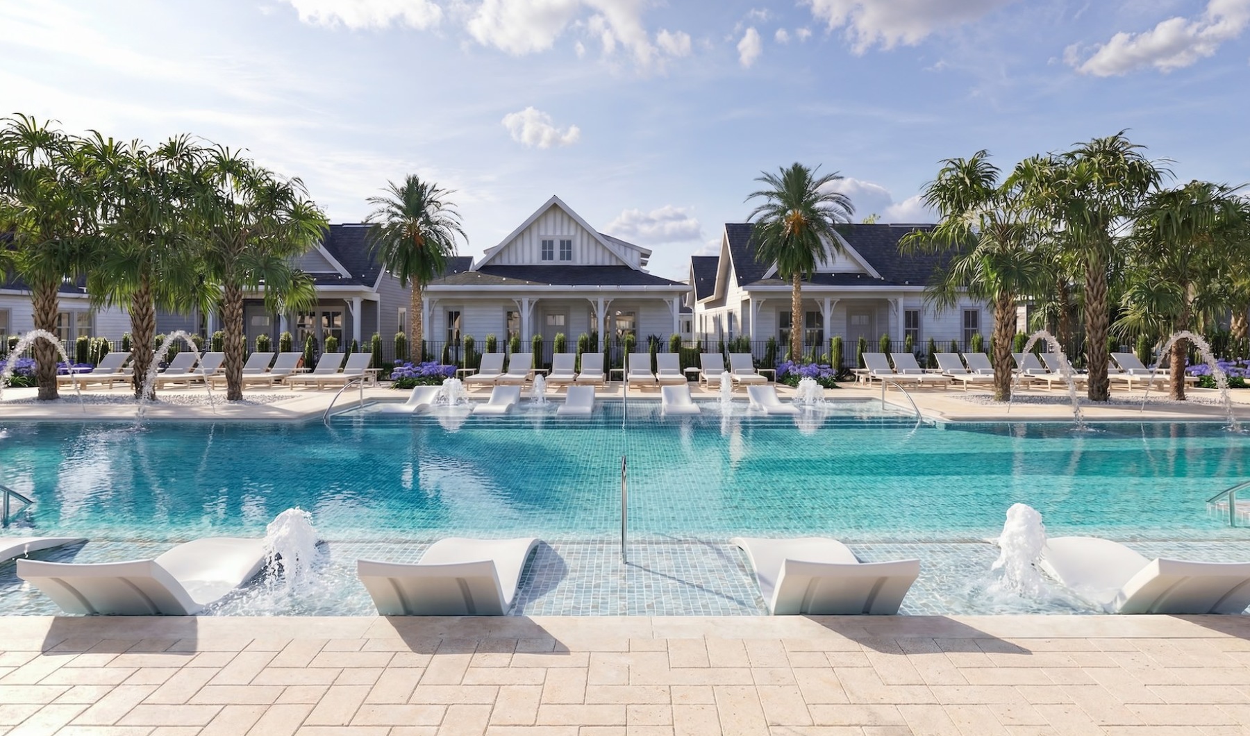 a swimming pool with lounge chairs